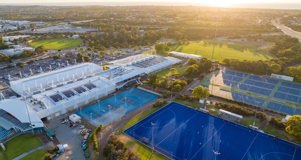An aerial shot of the Arena Joondalup complex, focusing on the hockey and netball courts